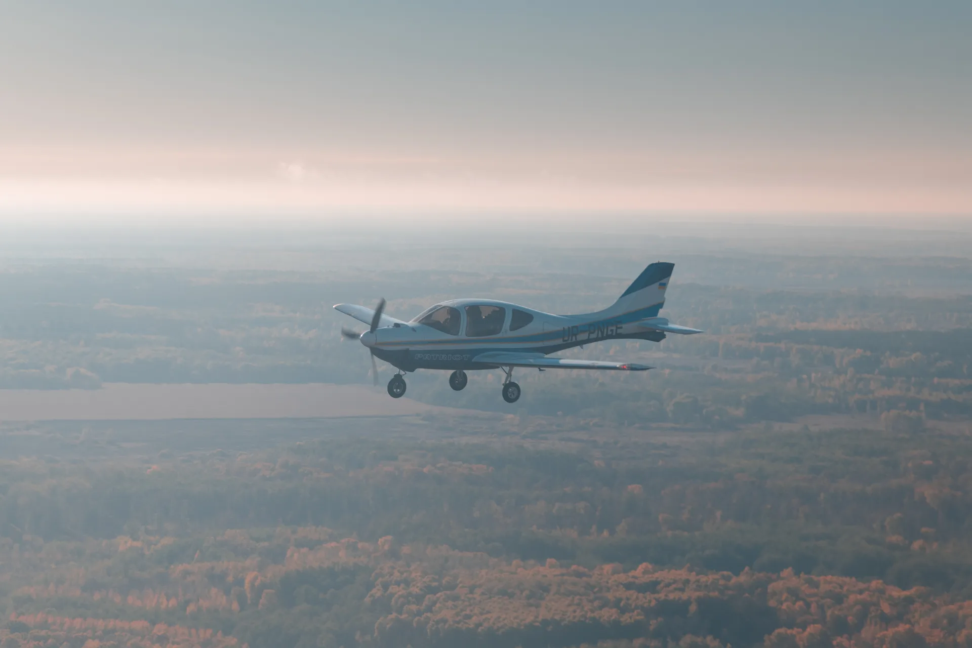 ANG aircraft in flight over open fields